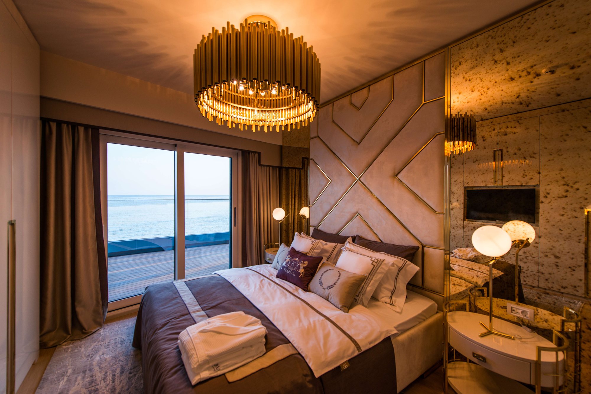 Sea Pearl Ataköy master bedroom opening onto a sea-view terrace